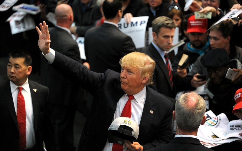 Donald Trump waving on campaign trail