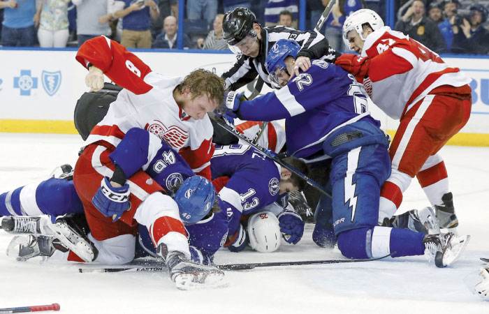 Members of the Detroit Red Wings and Tampa Bay Lightning fight during the third period in Game Two of their Eastern Conference quarterfinals at Amalie Arena in Tampa Florida Friday. — AFP