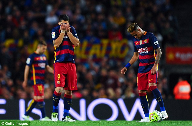 Luis Suarez and Neymar of Barcelona look dejected after Santi Mina scored Valencia's second goal