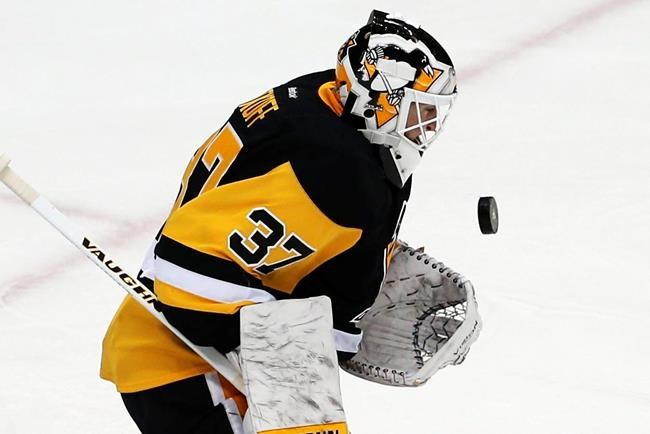 Pittsburgh Penguins goalie Jeff Zatkoff stops a shot against the New York Rangers during the first period in Game 2 in the first round of the NHL Stanley Cup playoffs in Pittsburgh Saturday