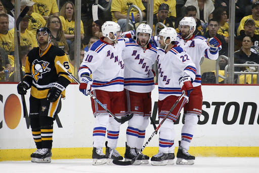 New York Rangers Derick Brassard celebrates his goal with teammates during the second period of Game 2 in the first round of the NHL Stanley Cup playoffs against the Pittsburgh Penguins in Pittsburgh Saturday April 16