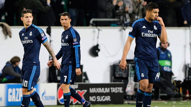 Real Madrid's James Rodriguez Cristiano Ronaldo and Carlos Henrique Casemiro from left leave the pitch after losing during the Champions League first leg quarter-final soccer match between against Wolfsburg in Wolfsburg Germany on Wednesday