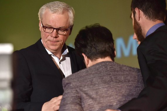 Manitoba NDP leader Greg Selinger stands with his wife Claudette and family on stage at his party's post election gathering