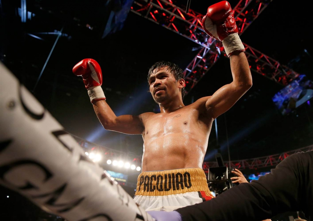 Manny Pacquiao celebrates after defeating Timothy Bradley Jr