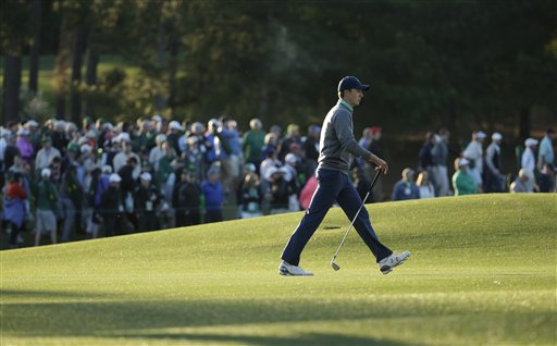 Jordan Spieth walks along the 18th fairway during the third round of the Masters golf tournament Saturday