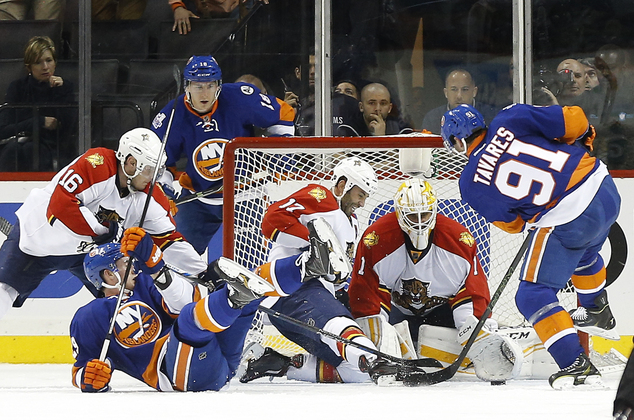 Florida Panthers goalie Roberto Luongo makes a save on a shot by New York Islanders center John Tavares during the third period of Game 4 of an NHL