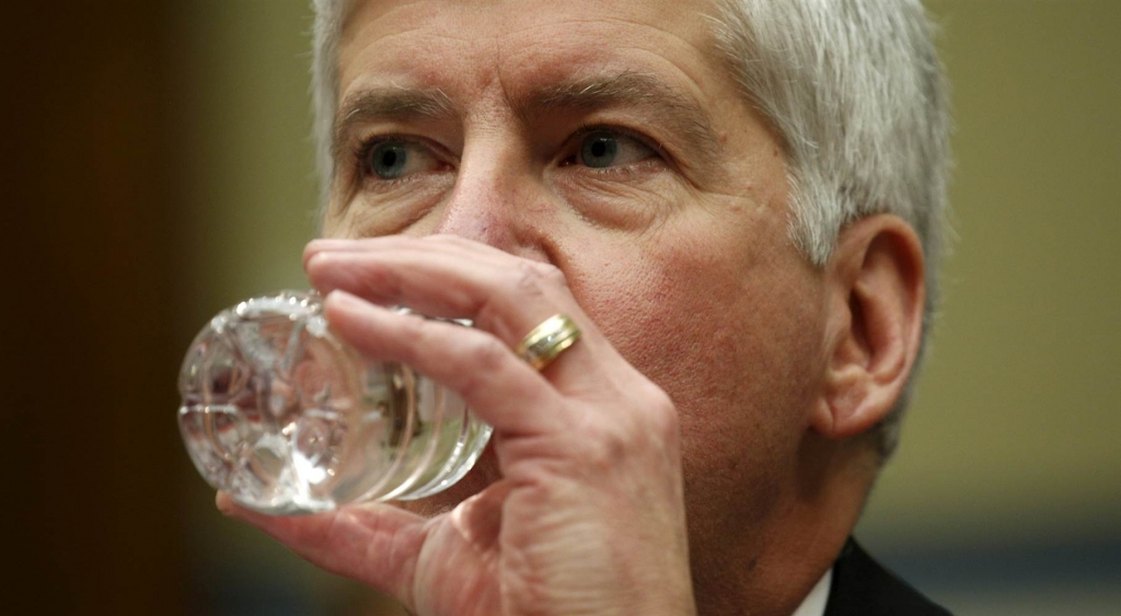 Image Michigan Governor Rick Snyder drinks some water as he testifies for Flint Michigan water hearing on Capitol in Washington