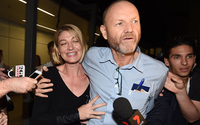 60 Minutes journalist Tara Brown and 60 Minutes producer Stephen Rice arrive at Sydney International Airport