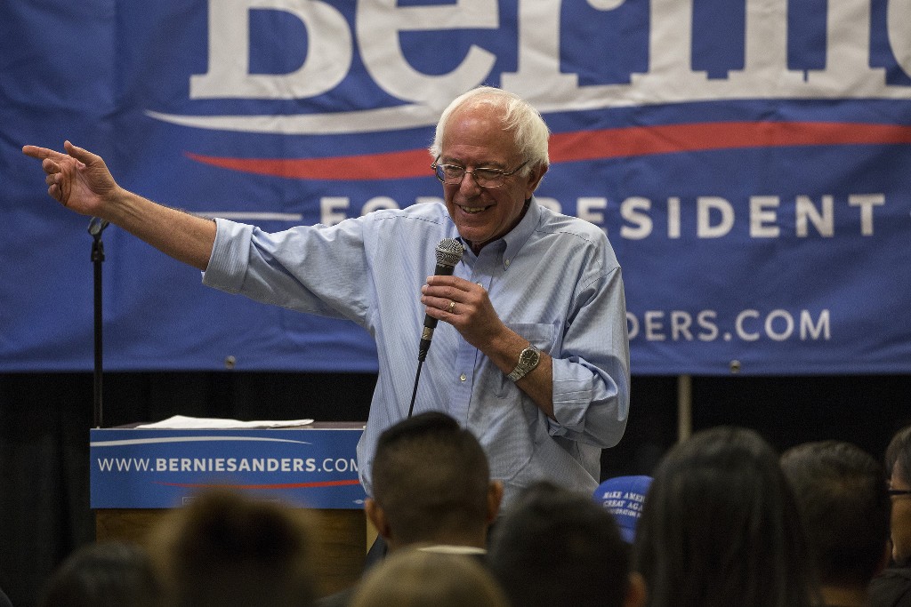 Bernie Sanders speaks in front of a crowd of enthusiastic supporters