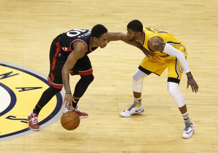 Apr 21 2016 Indianapolis IN USA Toronto Raptors forward De Mar DeRozan is guarded by Indiana Pacers forward Paul George in the first quarter in game three of the first round of the 2016 NBA Playoffs at Bankers Life Fieldhouse. Mandatory Cred