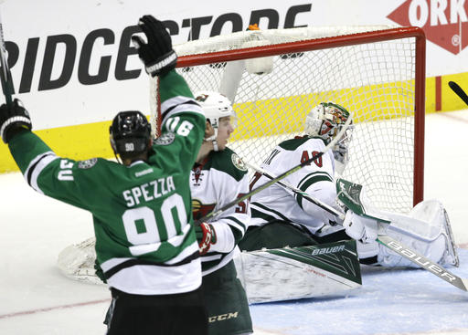 Dallas Stars center Jason Spezza starts to celebrate his goal against Minnesota Wild left wing Erik Haula and goalie Devan Dubnyk during the third period in Game 5 of a first-round NHL hockey Stanley Cup playoff series Friday