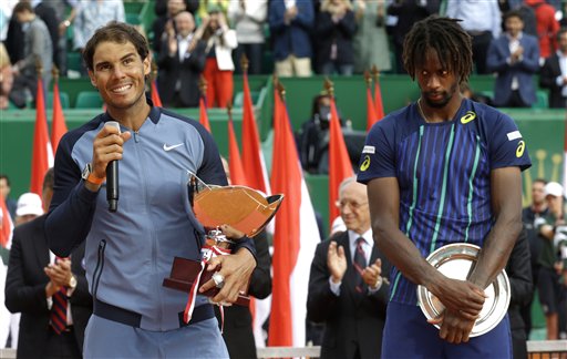 Spain's Rafael Nadal holds his cup after defeating France's Gael Monfils right in the final match of the Monte Carlo Tennis Masters tournament in Monaco Sunday