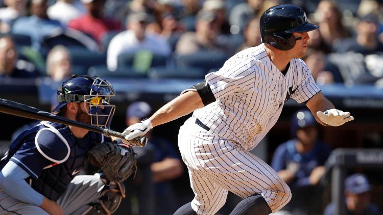 New York Yankees left fielder Brett Gardner hits an RBI single against the Tampa Bay Rays during the seventh inning at Yankee Stadium