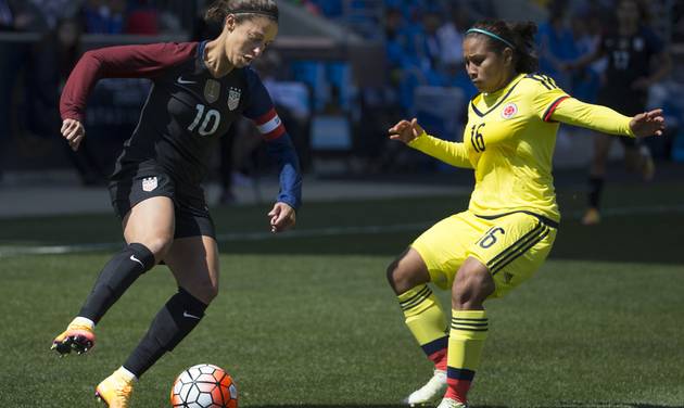 United States&#039 Carli Lloyd looks to make her move on Colombia's Leicy Santos during the first half of an international friendly soccer match Sunday