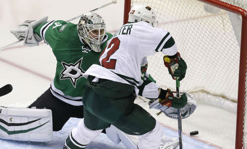 Minnesota Wild right wing Nino Niederreiter scores a goal against Dallas Stars goalie Antti Niemi during the third period in Game 5 of a first-round NHL hockey Stanley Cup playoff series Friday