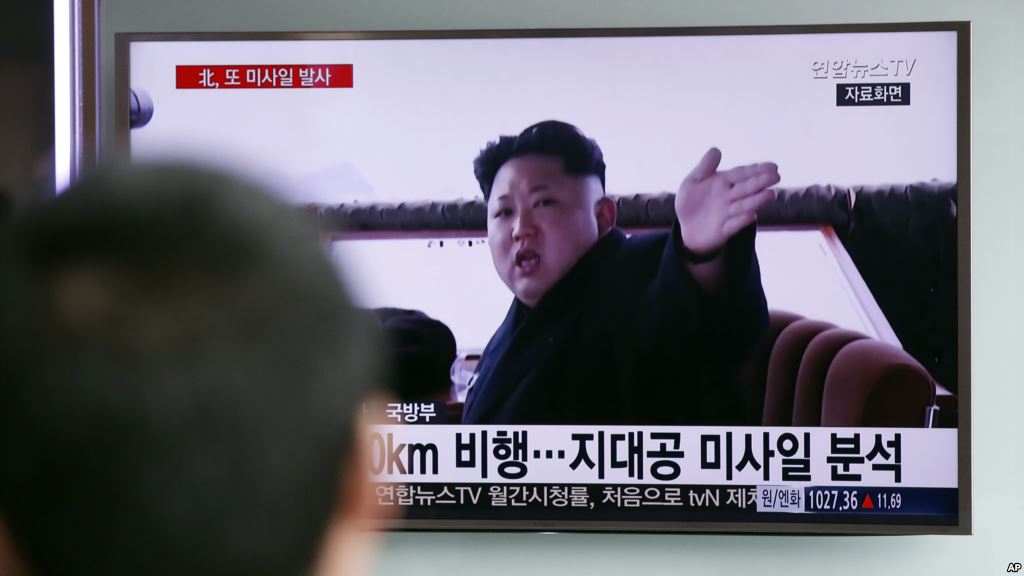 FILE- A man watches a TV news program showing a file footage of North Korean leader Kim Jong Un at Seoul Railway Station in Seoul South Korea Friday