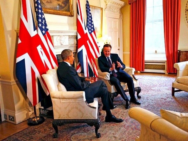 President Barack Obama and British Prime Minister David Cameron shakes hands during a joint news conference at 10 Downing Street Cameron's official residence in London Friday