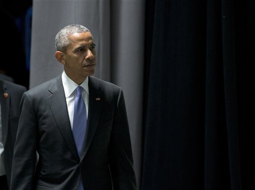 President Barack Obama arrives for the afternoon plenary session of the Nuclear Security Summit Friday