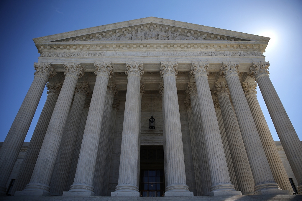 Washington DC following the first 4-4 tie in a case before the court. The decision resulted in a victory for unions in a case that challenged the need for public workers to help