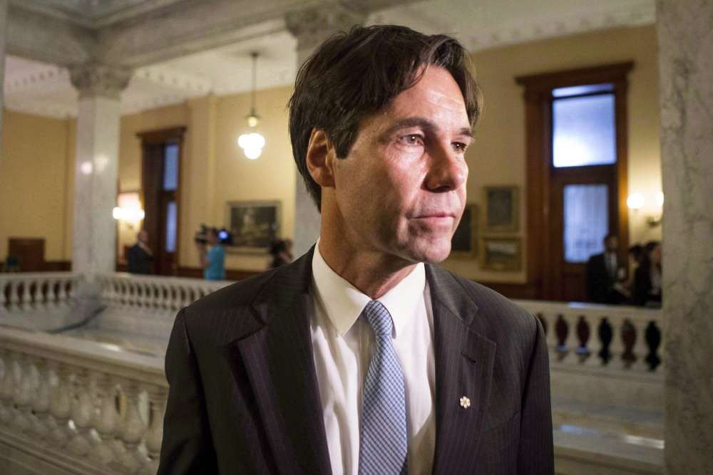 Eric Hoskins makes his way to a cabinet briefing after being sworn in as Ontario health minister at Queens Park in Toronto