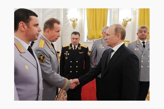 Putin right shakes hands with then Interior Troops Commander Viktor Zolotov at a meeting with senior officers in the Kremlin in Moscow Russia. Putin has ordered the creation of