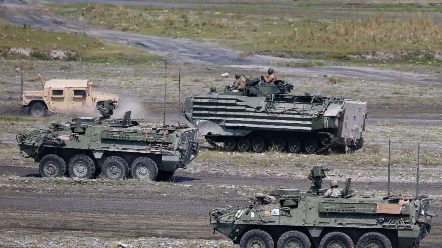 U.S. military armored personnel carriers take their positions during the 11-day joint US-Philippines military exercise dubbed'Balikatan 2016  Thursday