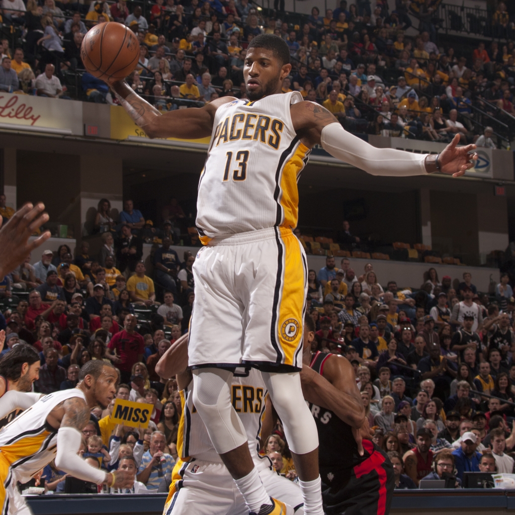 Paul George skies for a rebound against the Raptors