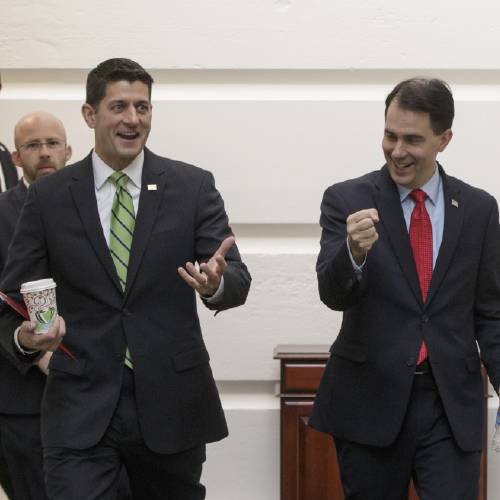 Paul Ryan of Wis. left has an animated discussion with former GOP presidential candidate Wisconsin Gov. Scott Walker on the way to a closed-door meeting of House Republicans on Capitol Hill in Washington Wednesday