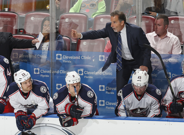 Columbus Blue Jackets coach John Tortorella signals goaltender Curtis Mc Elhinney to skate to the bench for an extra skater durin