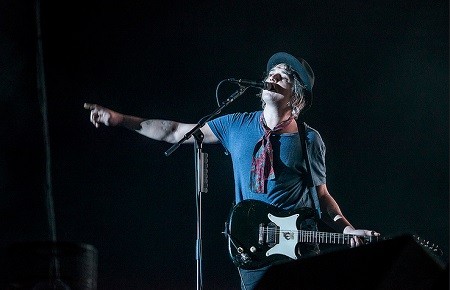 Pete Doherty performing with The Libertines