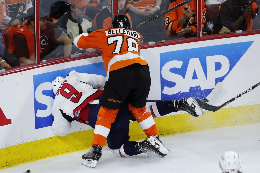 Philadelphia Flyers&#039 Pierre Edouard Bellemare collides with Washington Capitals&#039 Dmitry Orlov during the third period of Game 3 in the first round of the NHL Stanley Cup hockey playoffs Monday