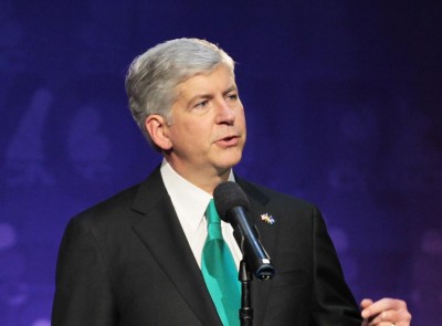 Michigan Gov. Rick Snyder speaks prior to the start of a Republican Presidential debate hosted by CNBC and the Michigan Republican Party at Oakland University