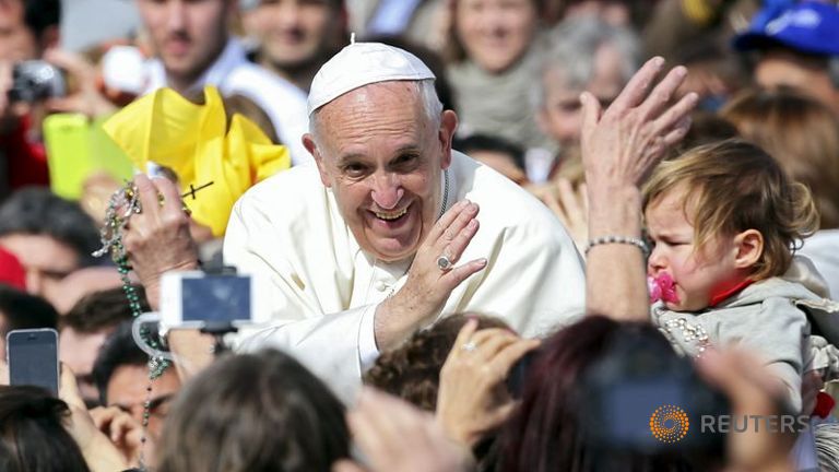 Pope Francis waves as he arrives at a Jubilee audience in Saint Peter's Square at the Vatican