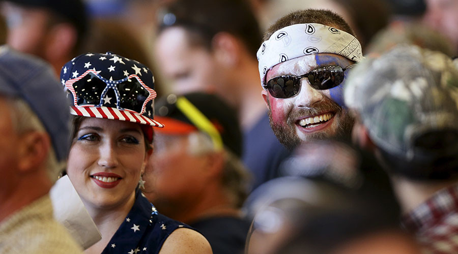 Two supporters of Republican U.S. presidential candidate Donald Trump attend a Trump campaign rally two days before the Maryland presidential primary election at the airport in Hagerstown Maryland U.S