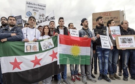 Protesters demonstrate against Syrian President Assad at peace talks in Geneva in January 2016