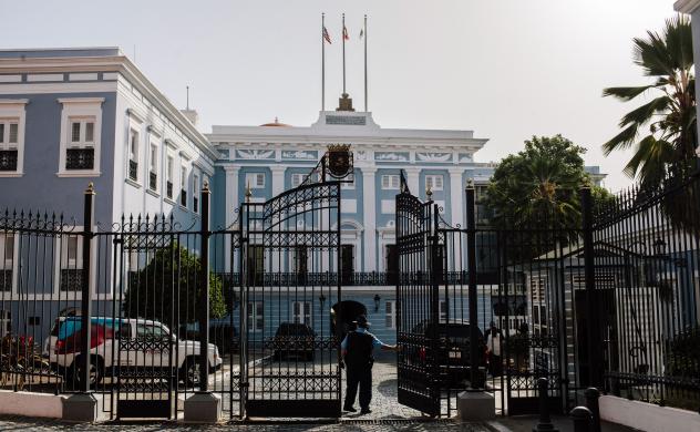 A security guard stands at the gate of the Governor's Mansion known as the La Fortaleza in San Juan Puerto Rico