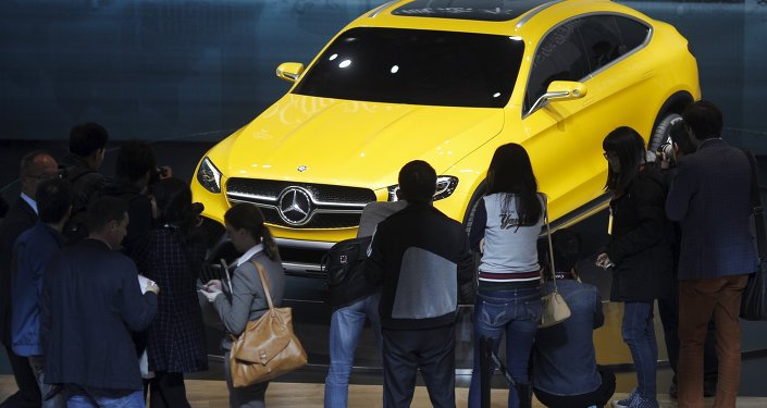 Visitors walk around a Mercedes Benz concept GLC Coupe car during the 16th Shanghai International Automobile Industry Exhibition in Shanghai