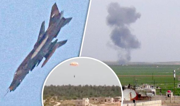 A jet belonging to the forces of Syrian President Bashar Al Assad is seen in the sky during an air strike in the Hama countryside