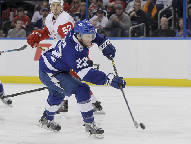 Tampa Bay Lightning right wing Erik Condra shoots and scores beating Detroit Red Wings goalie Jimmy Howard for the first goal of the game during first period action at the Amalie Arena in Tampa on March 22