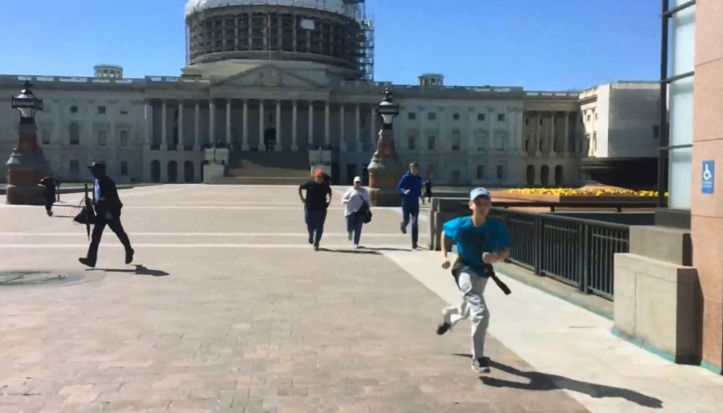 ReutersTourists run for safety past the entrance to the U.S. Capitol Visitors Center after Larry Dawson was shot by a police officer