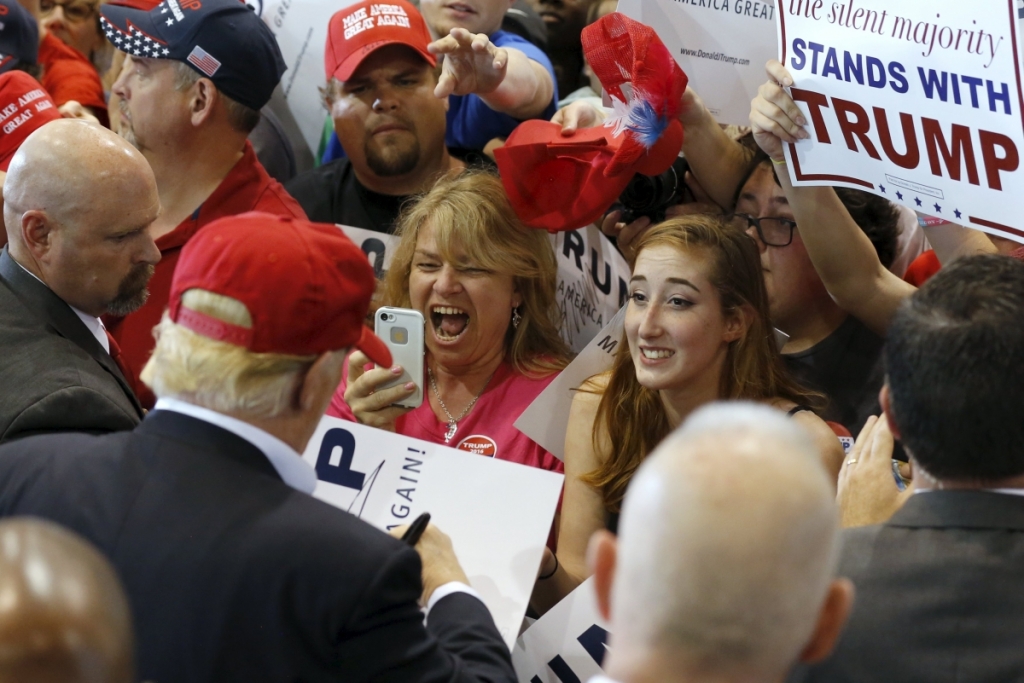 ReutersUS Republican presidential candidate Donald Trump signs autographs for supporters after a rally in Harrington Delaware