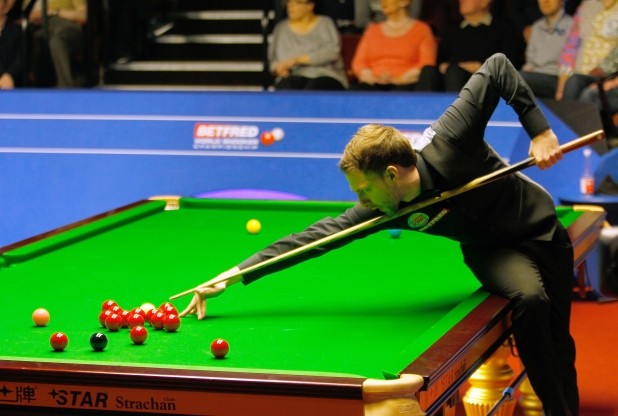 Judd Trump in action against Ding Junhui