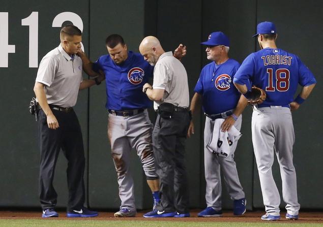 Ross D. Franklin  AP  Kyle Schwarber was carted off the field following his collision with Dexter Fowler