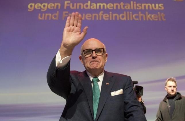 Rudy Giuliani former Mayor of New York City waves to public during a conference in Berlin