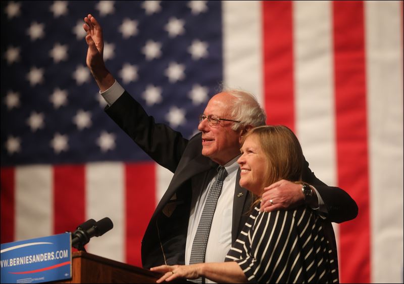 Democratic presidential candidate Sen. Bernie Sanders I-Vt. waves to the crowd with his wife Jane Sanders by his side during a campaign rally Tuesday evening in the Arts and Sciences Auditorium at the University of Wyoming campus