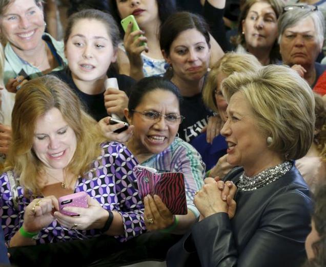 US Democratic presidential candidate Hillary Clinton reacts as she interacts with potential supporters along a rope line after speaking at a campaign rally in Central Falls Rhode Island on Saturday.- Reuters