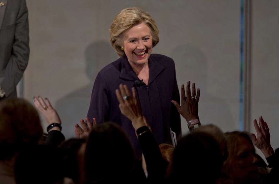 Democratic presidential candidate Hillary Clinton greets members of the audience during a Glassdoor Pay Equality Roundtable Tuesday