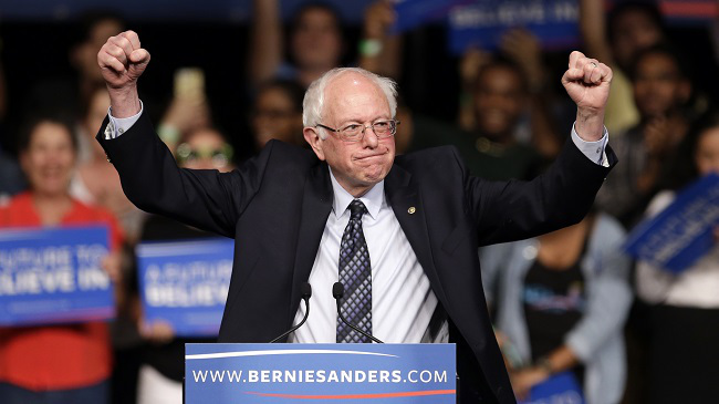 Democratic presidential candidate Sen. Bernie Sanders I-Vt. acknowledges his supporters on arrival at a campaign rally Tuesday