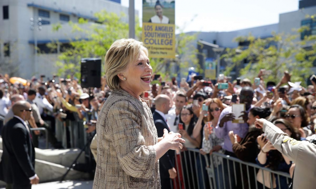 Democratic presidential candidate Hillary Clinton speaks to people in the overflow area during a campaign event at the Los Angeles Southwest College on Saturday