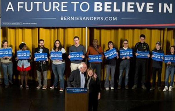 Democratic presidential candidate Sen. Bernie Sanders I-Vt. kisses his wife Jane as they arrive on stage during a campaign event Saturday